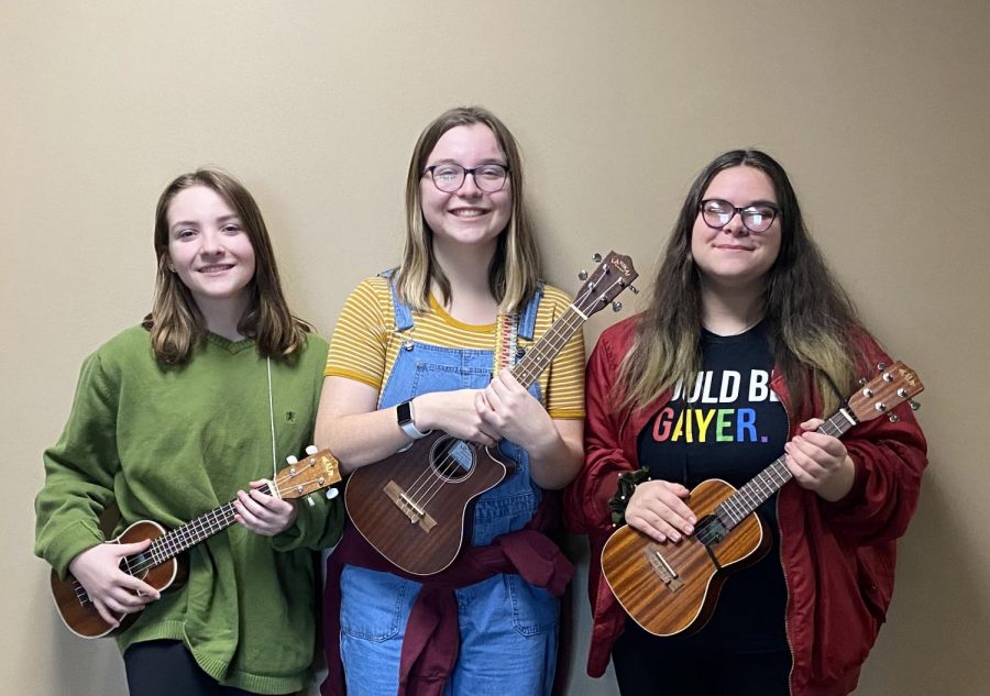 Elise Keuning, Sage Etling, and Lillian Gilroy with their instruments after a Ukulele Club meeting.  Alyssa Williams photo.