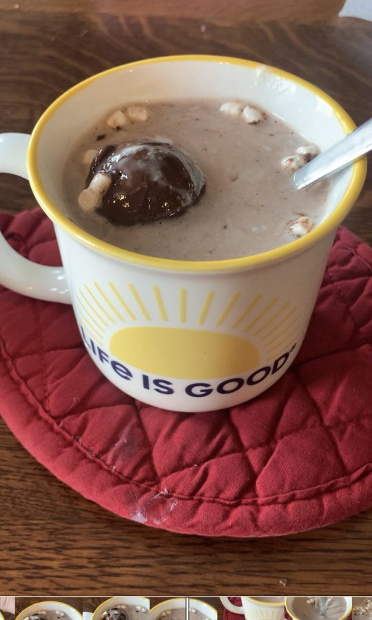 Hot chocolate bomb in glass of milk. 