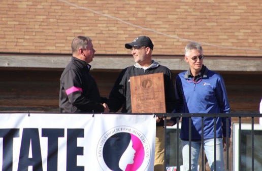 Coach Chad Willeford receiving the plaque at the state cross country meet on Oct. 29th. Gwen Willeford photo.