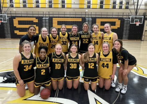 Girls basketball team posing for a photo. Rachael Nelson photo.