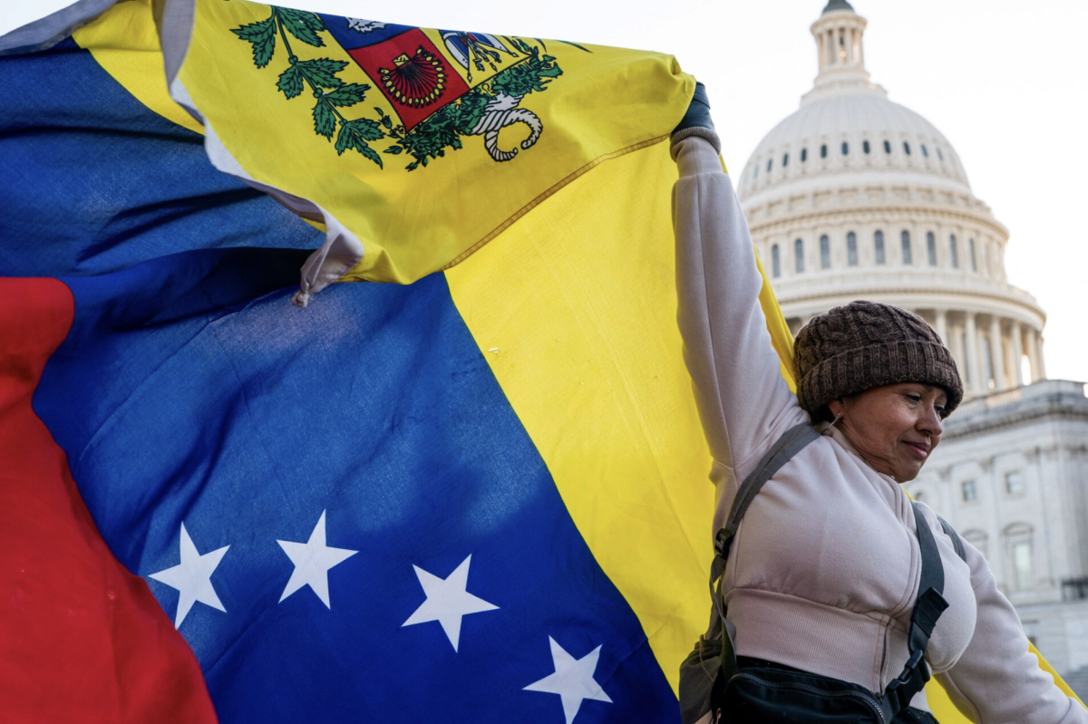 A woman holds a Venezuelan flag outside the U.S. Capitol. Photo courtesy of Reuters.